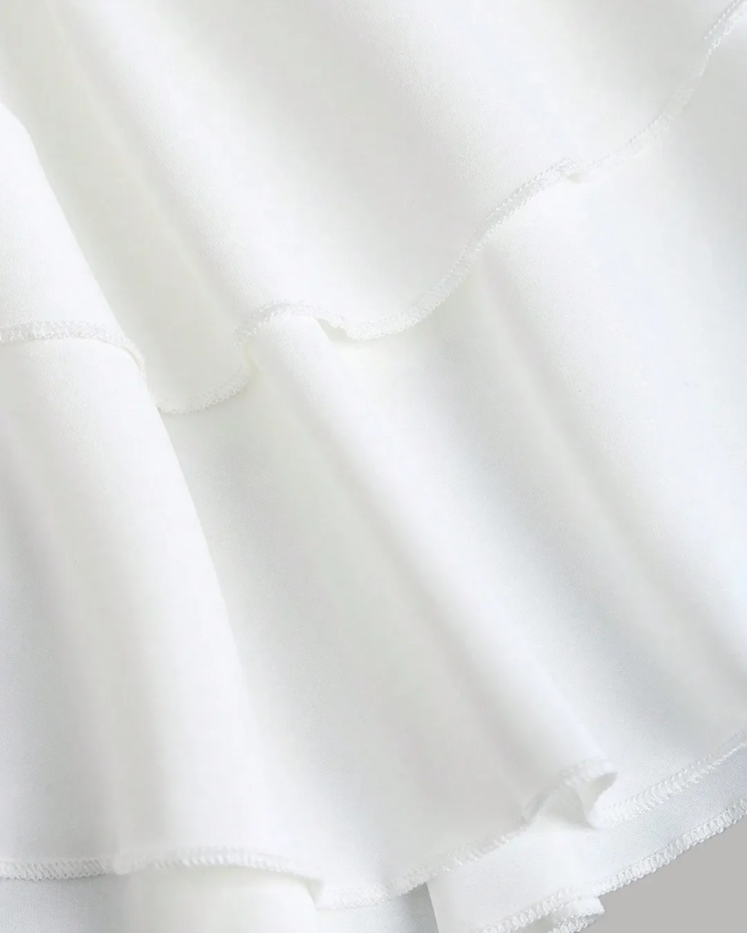 Ruched White Halter Neck Mini Dress with Tiered Layers - Image 3
