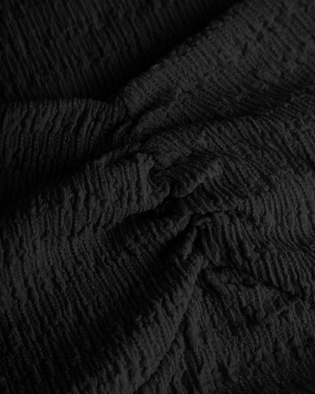 Ribbed Long Sleeve Flared Hem Statement Top in Black - Image 4
